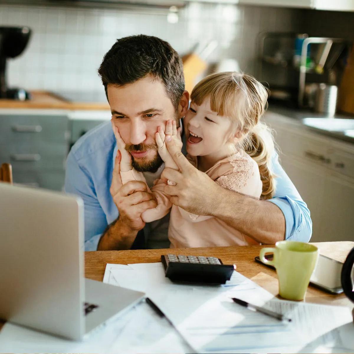 Family reviewing financial documents and USDA eligibility map at a kitchen table